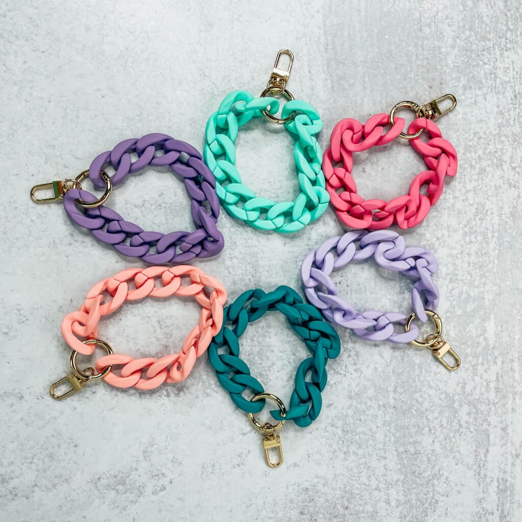 Acrylic Chain Keychain in 6 colors laid out in a rainbow of colors