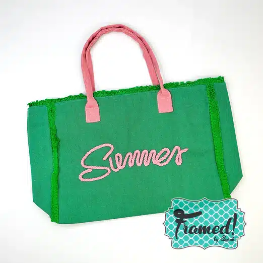 Green beach tote with the word "Summer" written in Pink roping on the front and a matching pink handle