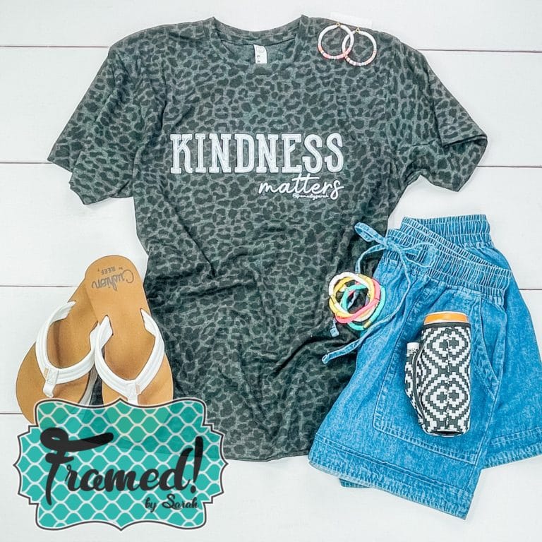 Leopard print Kindness Matters T-shirt Club Tee styled with denim shorts and bright accessories