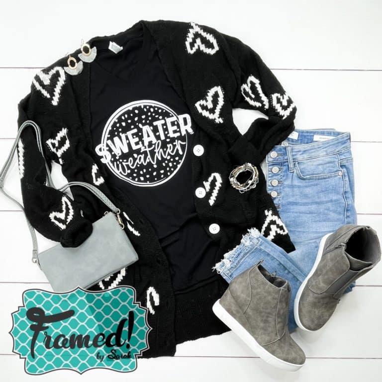Black hear cardigan with Sweater Weather tshirt jeans and gray shoes