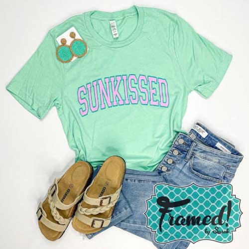 Mint Sunkissed t-shirt styled with bluejeans, tan sandals, and turquoise disk earrings