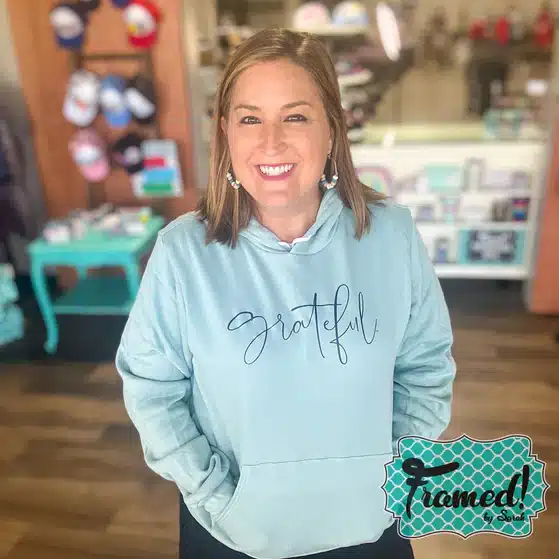 Woman wearing blue Grateful Super Soft Hoodie