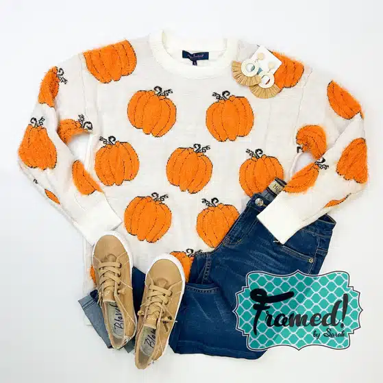 Fuzzy Pumpkin Sweater styled with dark wash jeans and tan sneakers