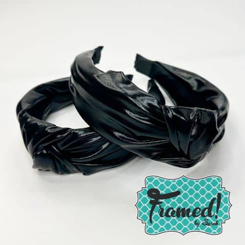 two Faux Black Leather Headbands casually stacked on top of each other