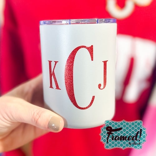 light gray tumbler with red monogram