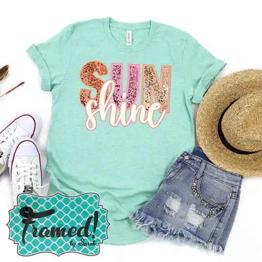 aqua t-shirt with sequin patch that says "SunShine" styled with denim shorts, straw hat, and white shoes